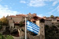 Greece. Meteora. The Greece flag with the Holy Monastery of Great Meteoron, the Transfiguration of Jesus. Royalty Free Stock Photo