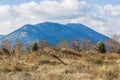 Greece mountain valley landscape country side village farming environment with cereals field on foreground and mountain on Royalty Free Stock Photo