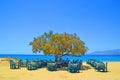 greece naxos sea tables chairs on the beach summer holidays background blue colors Royalty Free Stock Photo