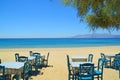 greece naxos sea tables chairs on the beach summer holidays background Royalty Free Stock Photo