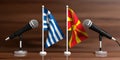 Greece and North Macedonia relations. Miniature flags on wooden background, 3d illustration Royalty Free Stock Photo