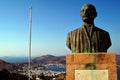 Greece, Patmos island, view of the statue of a Greek hero with the port town of Skala in the background Royalty Free Stock Photo