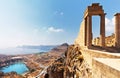 Ancient Temple of Athena Lindia the IV century BC in Lindos Acropolis and the St. Paul`s Bay in form of the heart on Greek Rhodes Royalty Free Stock Photo