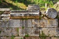 Greece ruins with green grass around in Akropol at sunny day