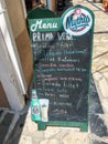 Chalk board menu with Mythos beer advertising at a restaurant in Kokkari on Samos,