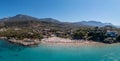 Greece, sandy beach, aerial drone view. People swim and relax at Stoupa beach Mani, Peloponnese