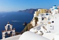 Famoust Oia town with white Cycladic houses and traditional arched bell tower on Santorini, Greece Royalty Free Stock Photo