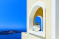 Greece Santorini island in Cyclades, traditional detail sights of colorful flowers with pots and caldera sea in background