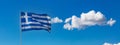 Greece sign symbol. Greek national official flag on flagpole waving in the wind, blue sky Royalty Free Stock Photo