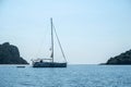 Greece summer vacation. Moored luxury yacht in calm sparkle light blue deep Aegean sea water Royalty Free Stock Photo