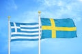 Greece and Sweden two flags on flagpoles and blue sky