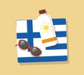 Greece Tourism. Towel in the sand with sun glasses and cream