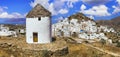 Greece travel, Cyclades. Ios island and old windmills Royalty Free Stock Photo