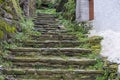 Greece, Tzia Kea island. Ioulis city narrow street with stairs and traditional stone walls Royalty Free Stock Photo