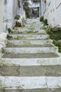 Greece, Tzia Kea island. Ioulis city narrow street with stairs and traditional stone walls