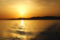 Greece, a view from a ferry on the journey to Athens as the sun sets.