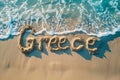 Greece written in the sand on a beach. Greek tourism and vacation background Royalty Free Stock Photo