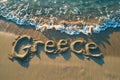 Greece written in the sand on a beach. Greek tourism and vacation background Royalty Free Stock Photo