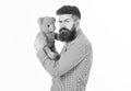 Greediness concept. Miserly hipster holds his toy. Guy with beard does not like to share soft toy. Royalty Free Stock Photo