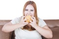 Greedy blonde woman eats hamburger Royalty Free Stock Photo