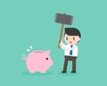 Greedy Businessman holding big hammer destroy piggy bank, saving