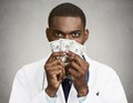 Greedy health care professional, doctor holding cash, money