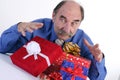 Greedy man with gifts Royalty Free Stock Photo