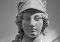 Greek ancient statue of goddess Athena. Woman marble head in helmet sculpture Royalty Free Stock Photo