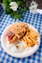 Greek souvlaki with pita bread and vegetables close-up on the table Royalty Free Stock Photo