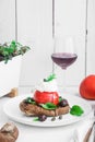 Barley rusk called dakos ,topped with feta cheese, tomato cubes,olive oil and oregano ,typical Greek plate served with Royalty Free Stock Photo