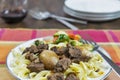Greek beef stifado with egg noodles and roasted vegetables Royalty Free Stock Photo