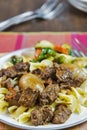 Greek beef stifado with egg noodles and roasted vegetables