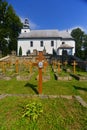 Greek catholic wooden church with graveyard