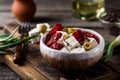 Greek cheese feta with herbs and olives, sundried tomatoes. Bulgarian cheese. Feta in oil. Olove oil. selective focus Royalty Free Stock Photo