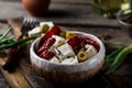 Greek cheese feta with herbs and olives, sundried tomatoes. Bulgarian cheese. Feta in oil. Olove oil. selective focus Royalty Free Stock Photo