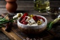 Greek cheese feta with herbs and olives, sundried tomatoes. Bulgarian cheese. Feta in oil. Olove oil. selective focus Royalty Free Stock Photo