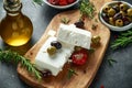 Greek cheese feta with thyme, rosemary, olives and stuffed red bell peppers Royalty Free Stock Photo