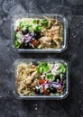 Greek chicken grain lunch box. Lemon herbs chicken, couscous, vegetables, olives, feta cheese lunch box on dark background, top