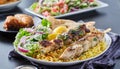 Greek chicken souvlaki platter with pita bread, salad and rice