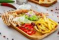 Greek Chicken Souvlaki with salad, french fries potato, pita and tzatziki sauce Royalty Free Stock Photo