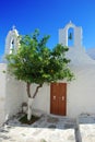 Typical white Greek church. Village square. Royalty Free Stock Photo