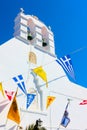 Greek church drcorated by flags Royalty Free Stock Photo