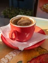 Greek coffee or Turkish served with foam on the top, Cyclades island, Greece. Vertical