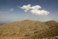Greek Crete mountain range with highest mountain Ida Psiloritis, very dry hard terrain with sharp rocks and stones, white clouds