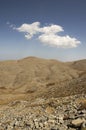 Greek Crete mountain range with highest mountain Ida Psiloritis, very dry hard terrain with sharp rocks and stones, white clouds