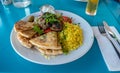 Greek dinner plate on blue table Royalty Free Stock Photo