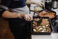 Greek dish in a baking tray standing on the stove