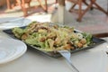 The Greek dish gyros on a rectangular plate with vegetables and greens Royalty Free Stock Photo