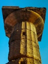 Greek doric pillar in Olympia with magical sunlight