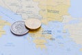 Greek Drachma and Euro cent on a Greek Map Royalty Free Stock Photo